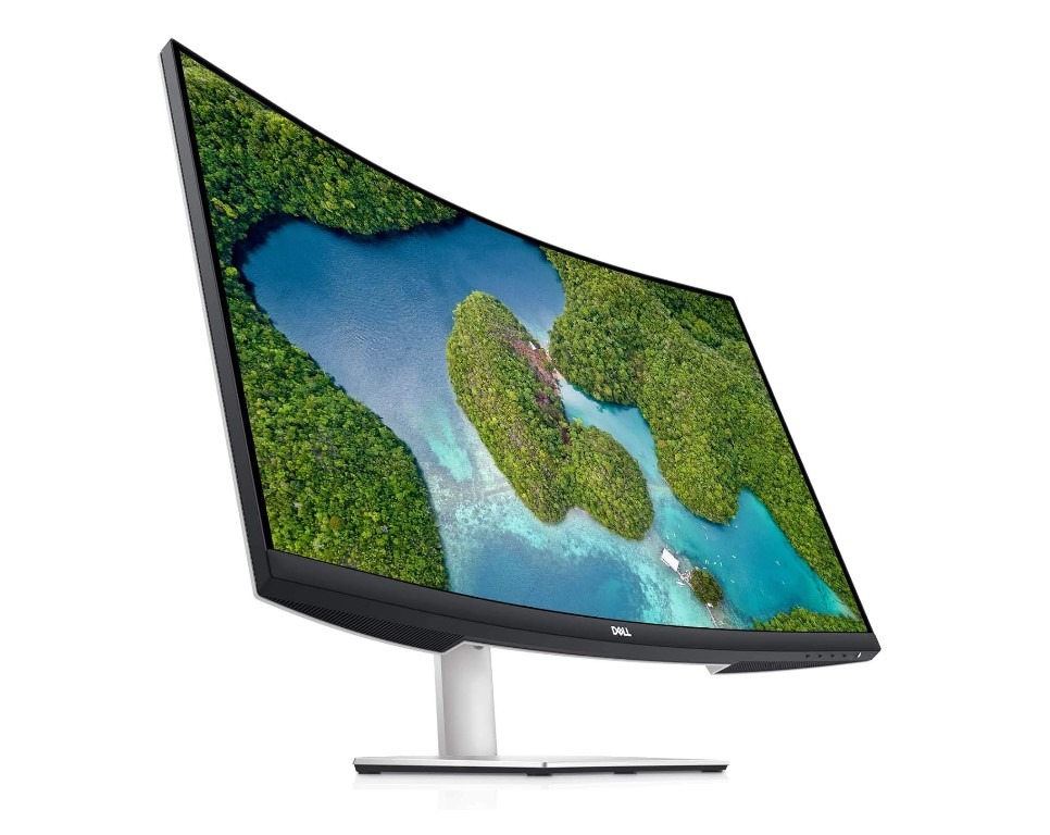 Curved monitor displaying tropical island aerial view.